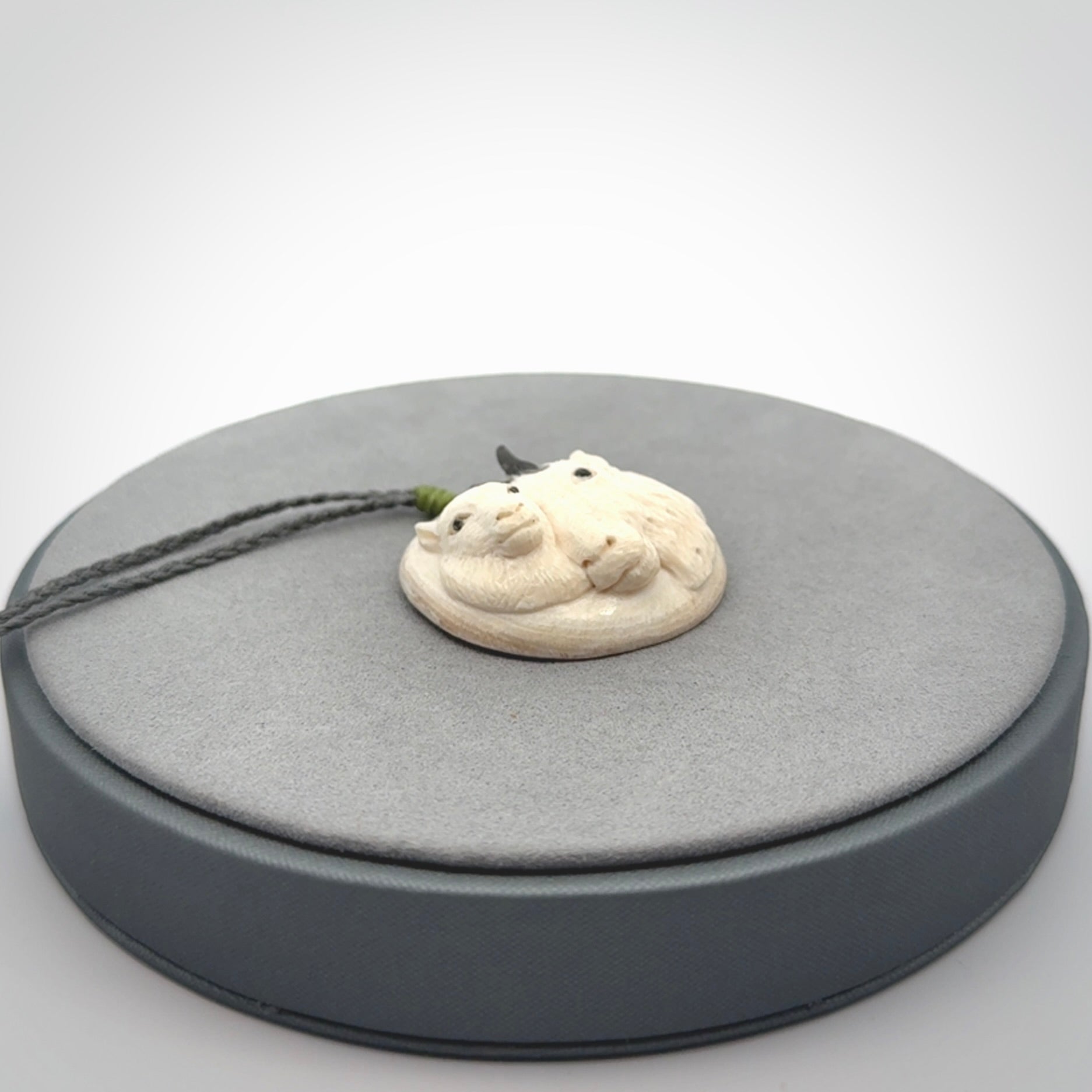 Merino and ewe pendant carved in mammoth tusk