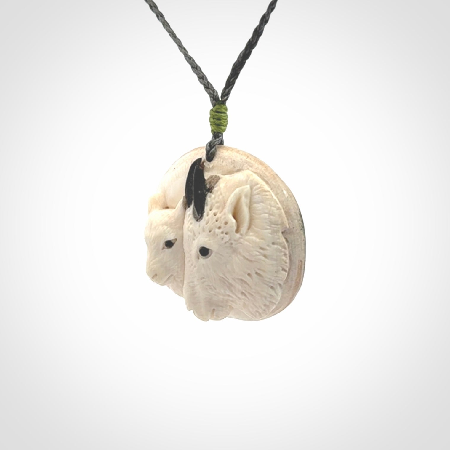 Merino and ewe pendant carved in mammoth tusk