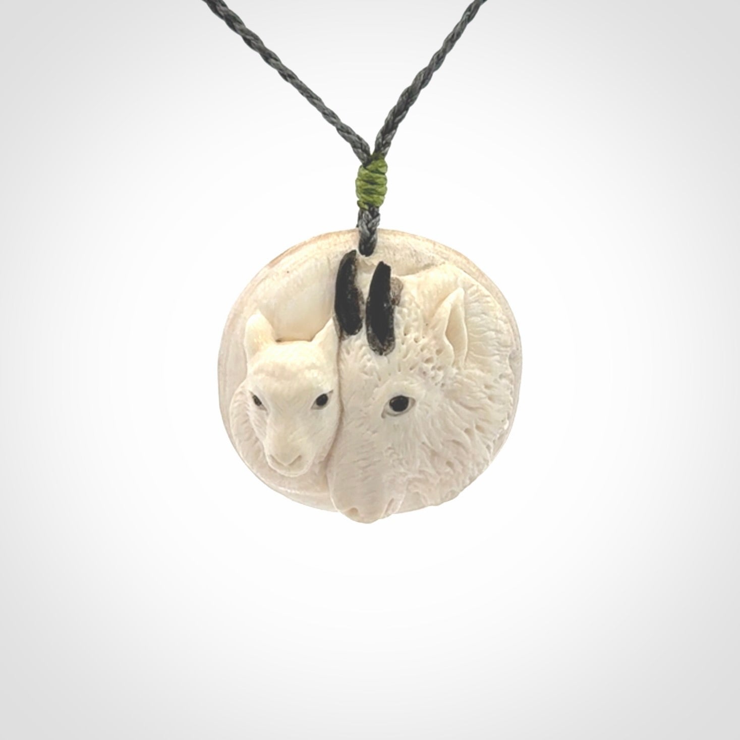 Merino and ewe pendant carved in mammoth tusk