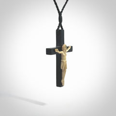 Hand carved black jade crucifix pendant. The cross has been carved from Australian black jade and the Christ from Woolly Mammoth Tusk. This is a beautiful crucifix that has been handmade by NZ Pacific. For sale online and shipping is free.
