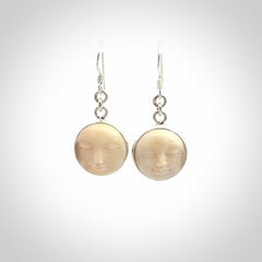 Hand made woolly mammoth tusk moon face earrings. Made by NZ Pacific and sale online only.