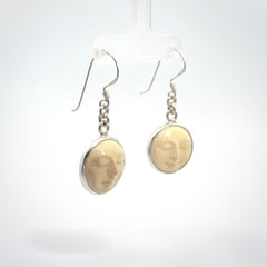 Hand made woolly mammoth tusk moon face earrings. Made by NZ Pacific and sale online only.