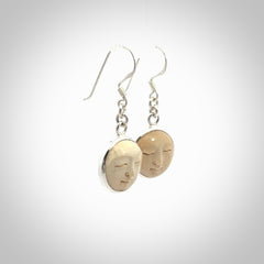 Hand made woolly mammoth tusk moon face earrings. Made by NZ Pacific and sale online only.