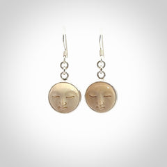 Hand made woolly mammoth tusk moon face earrings. Made by NZ Pacific and sale online only.