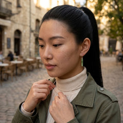 Woman wearing jade earrings