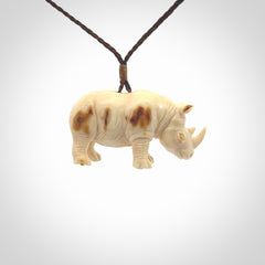 Hand carved Rhinoceros pendant. Carved from woolly mammoth tusk by NZ Pacific.