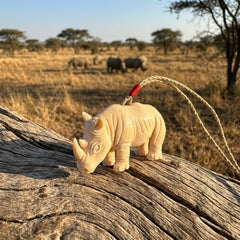 Rhino pendant carved in Woolly Mammoth Tusk
