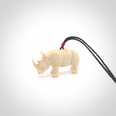Hand carved Rhinoceros pendant. Carved from woolly mammoth tusk by NZ Pacific.