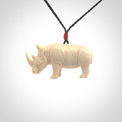 Hand carved Rhinoceros pendant. Carved from woolly mammoth tusk by NZ Pacific.