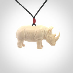 Hand carved Rhinoceros pendant. Carved from woolly mammoth tusk by NZ Pacific.