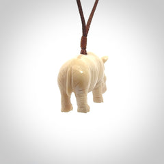 Hand carved Rhinoceros pendant. Carved from woolly mammoth tusk by NZ Pacific.
