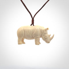 Hand carved Rhinoceros pendant. Carved from woolly mammoth tusk by NZ Pacific.