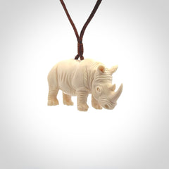 Hand carved Rhinoceros pendant. Carved from woolly mammoth tusk by NZ Pacific.