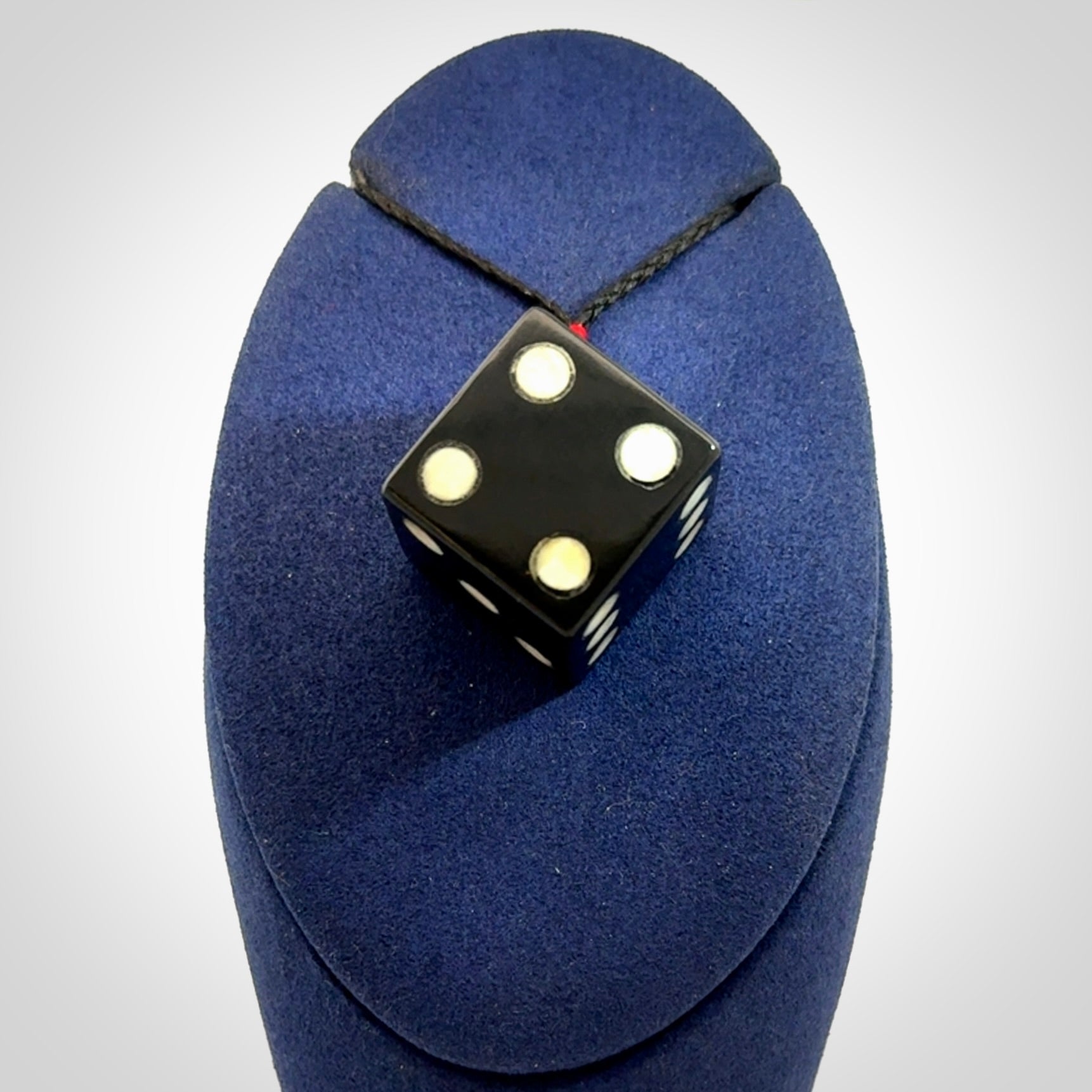 Hand carved black jade and bone dice pendant