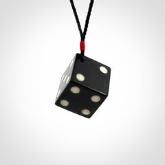 Hand carved black jade and bone dice pendant