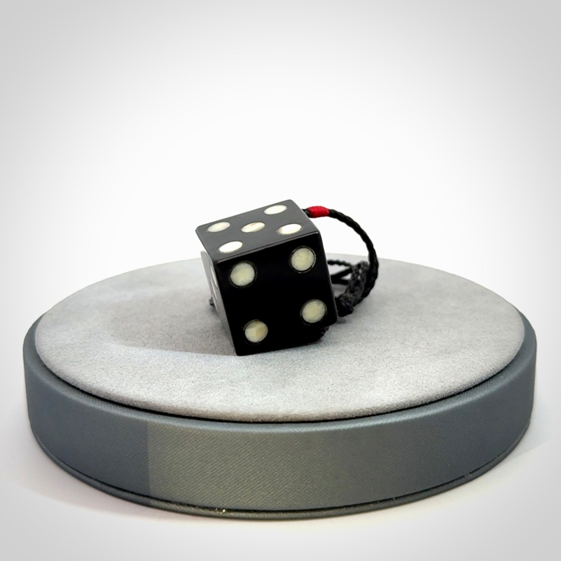 Hand carved black jade and bone dice pendant