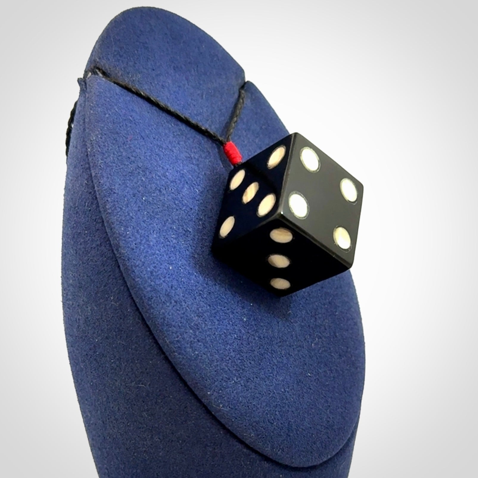 Hand carved black jade and bone dice pendant