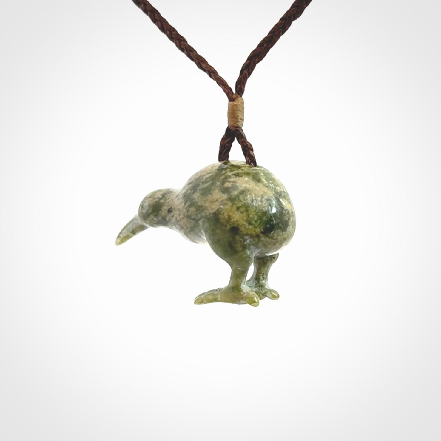 A beautiful little, handcarved kiwi pendant. This piece is carved from jade from Aceh and is a remarkably unique piece of handmade jewellery. made by NZ Pacific and for sale on our website. Shipping is free worldwide.