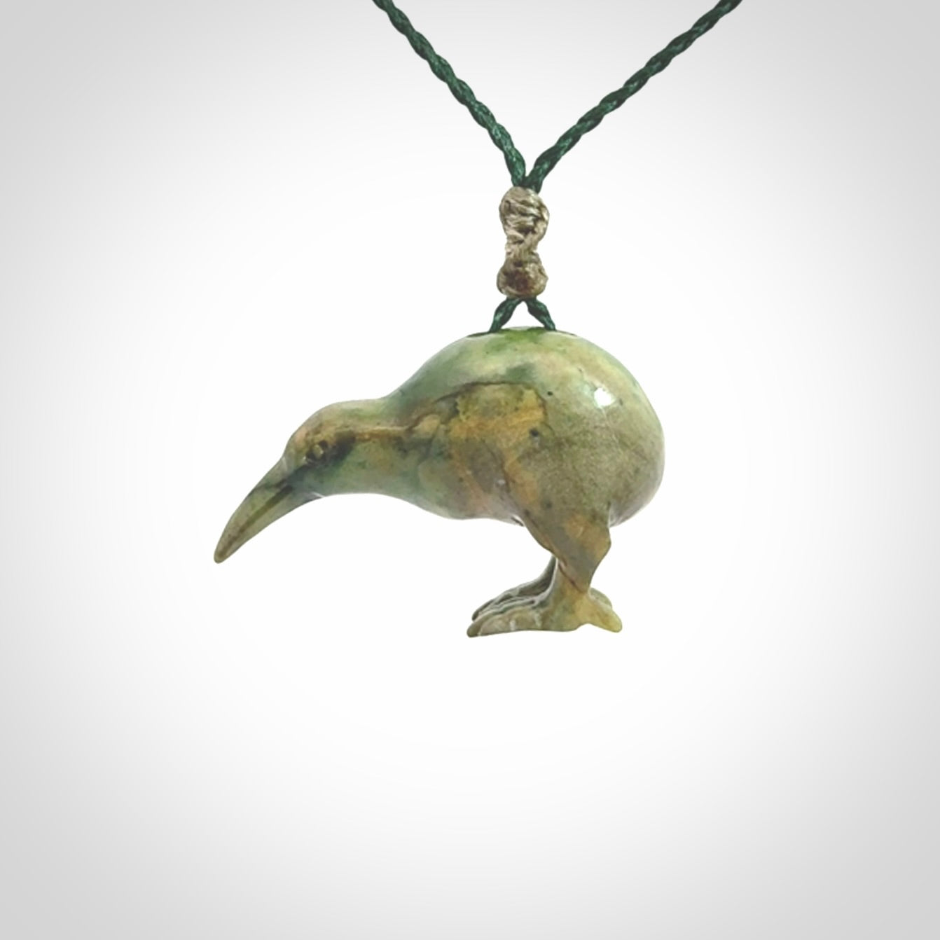 A beautiful little, handcarved kiwi pendant. This piece is carved from jade from Aceh and is a remarkably unique piece of handmade jewellery. made by NZ Pacific and for sale on our website. Shipping is free worldwide.