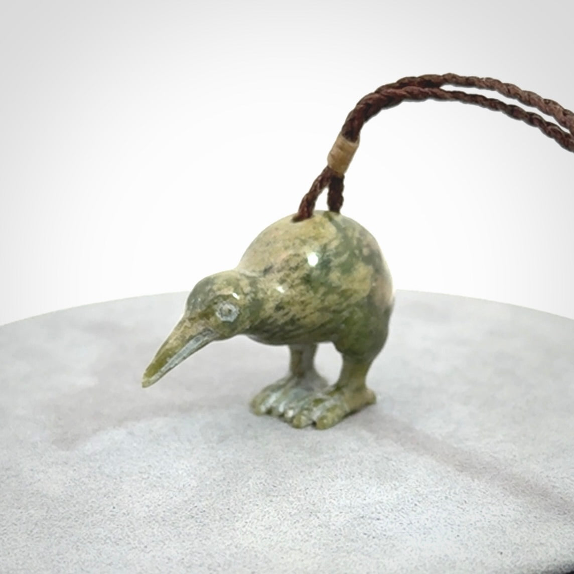 A beautiful little, handcarved kiwi pendant. This piece is carved from jade from Aceh and is a remarkably unique piece of handmade jewellery. made by NZ Pacific and for sale on our website. Shipping is free worldwide.