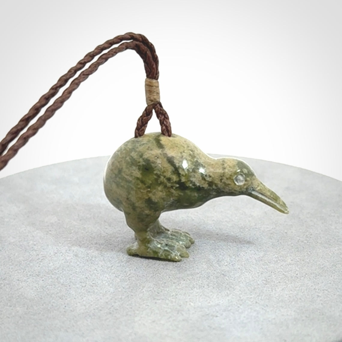 A beautiful little, handcarved kiwi pendant. This piece is carved from jade from Aceh and is a remarkably unique piece of handmade jewellery. made by NZ Pacific and for sale on our website. Shipping is free worldwide.