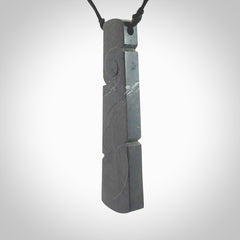 Hand made large New Zealand argillite toki pendant. Hand carved in New Zealand by Rueben Tipene. Hand made jewellery. Unique large argillite Toki with adjustable cord. Free shipping worldwide.