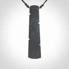 Hand made large New Zealand argillite toki pendant. Hand carved in New Zealand by Rueben Tipene. Hand made jewellery. Unique large argillite Toki with adjustable cord. Free shipping worldwide.