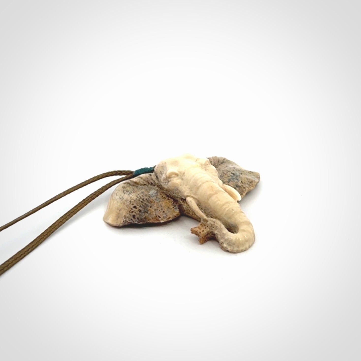 These are hand made elephant pendants, carved in a Deer Antler. The cord is length adjustable. Provided in a woven kete pouch and delivered with express courier.