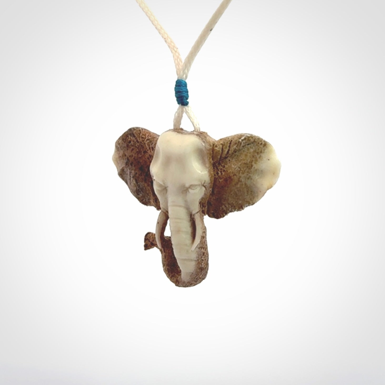 These are hand made elephant pendants, carved in a Deer Antler. The cord is length adjustable. Provided in a woven kete pouch and delivered with express courier.