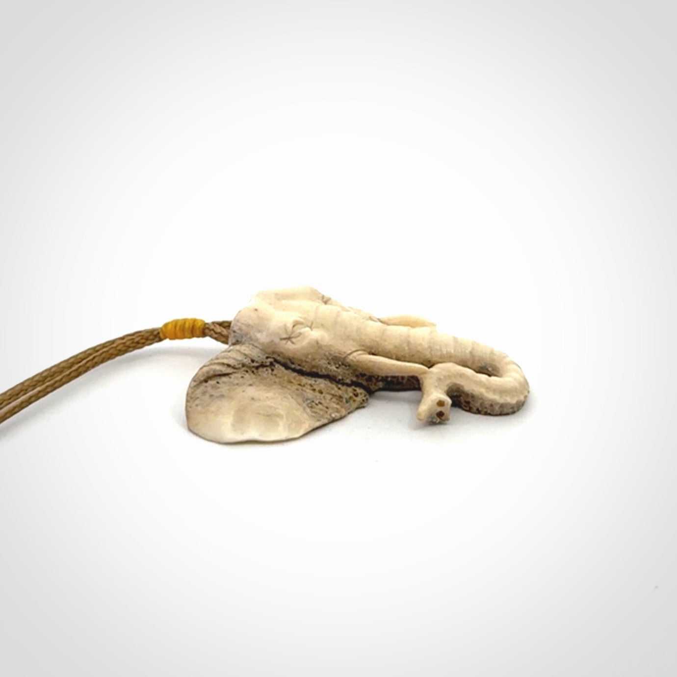 These are hand made elephant pendants, carved in a Deer Antler. The cord is length adjustable. Provided in a woven kete pouch and delivered with express courier.