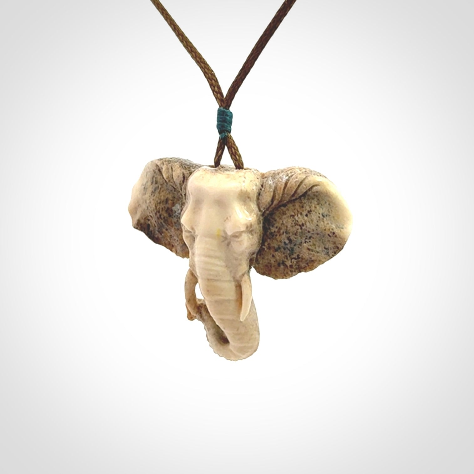 These are hand made elephant pendants, carved in a Deer Antler. The cord is length adjustable. Provided in a woven kete pouch and delivered with express courier.