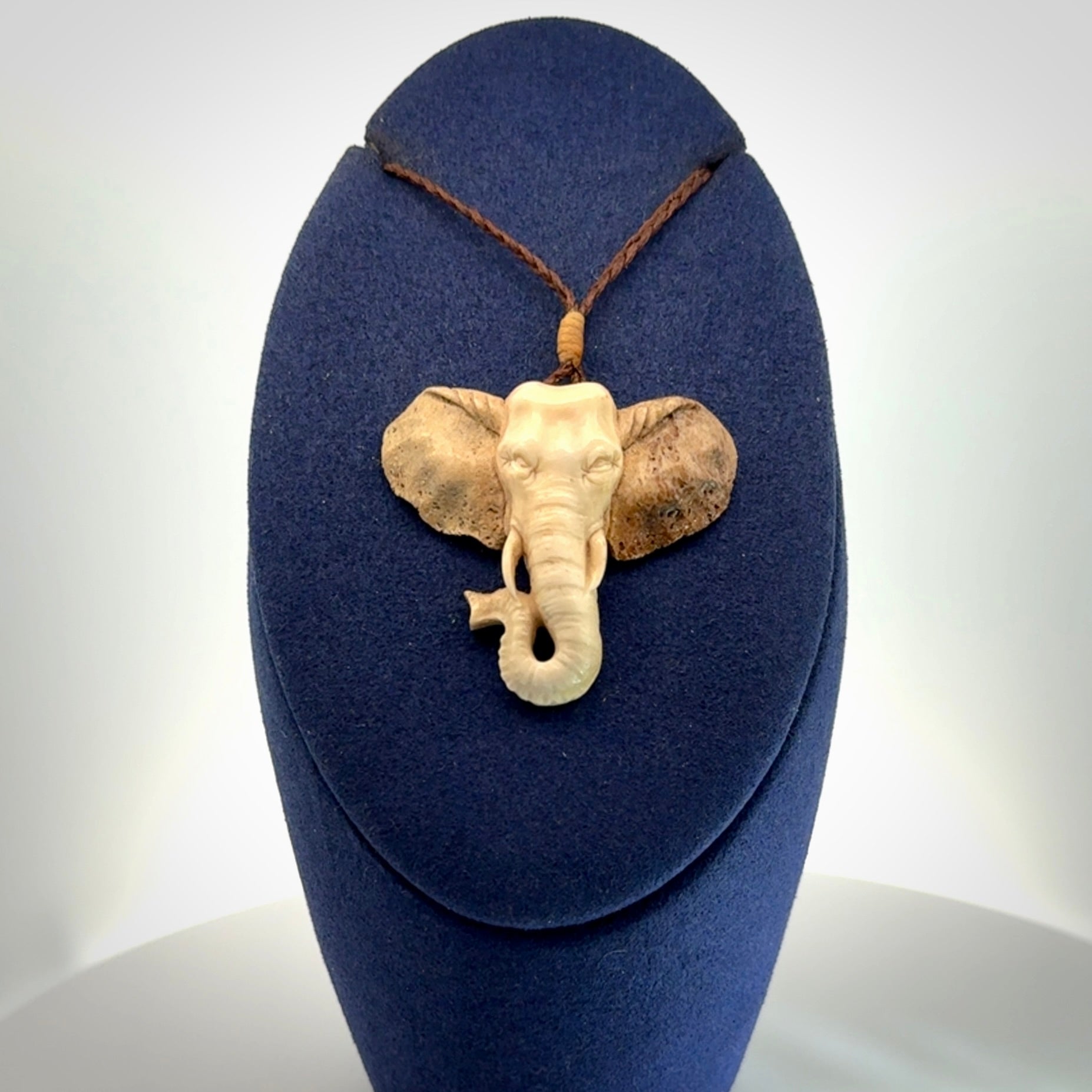 These are hand made elephant pendants, carved in a Deer Antler. The cord is length adjustable. Provided in a woven kete pouch and delivered with express courier.