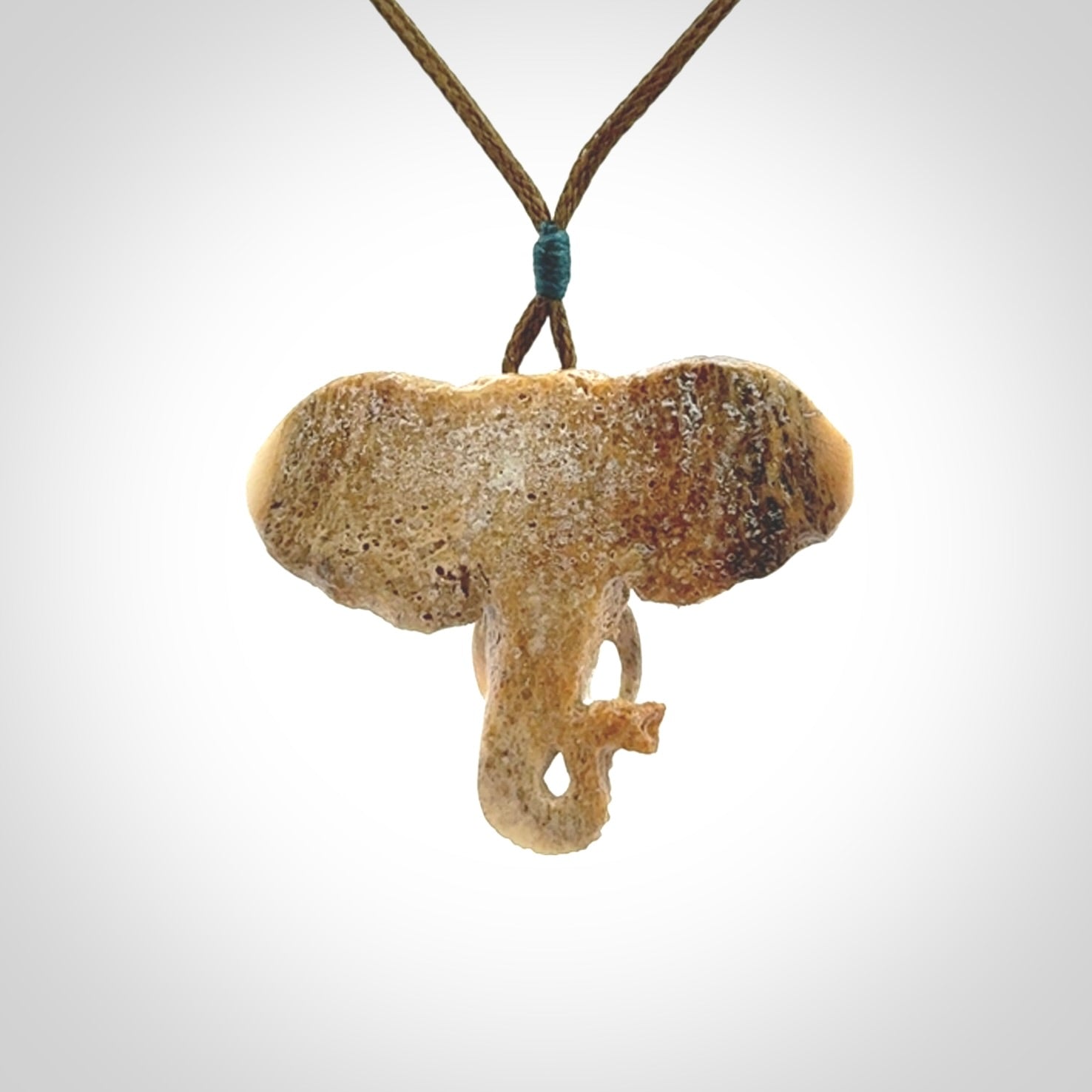 These are hand made elephant pendants, carved in a Deer Antler. The cord is length adjustable. Provided in a woven kete pouch and delivered with express courier.