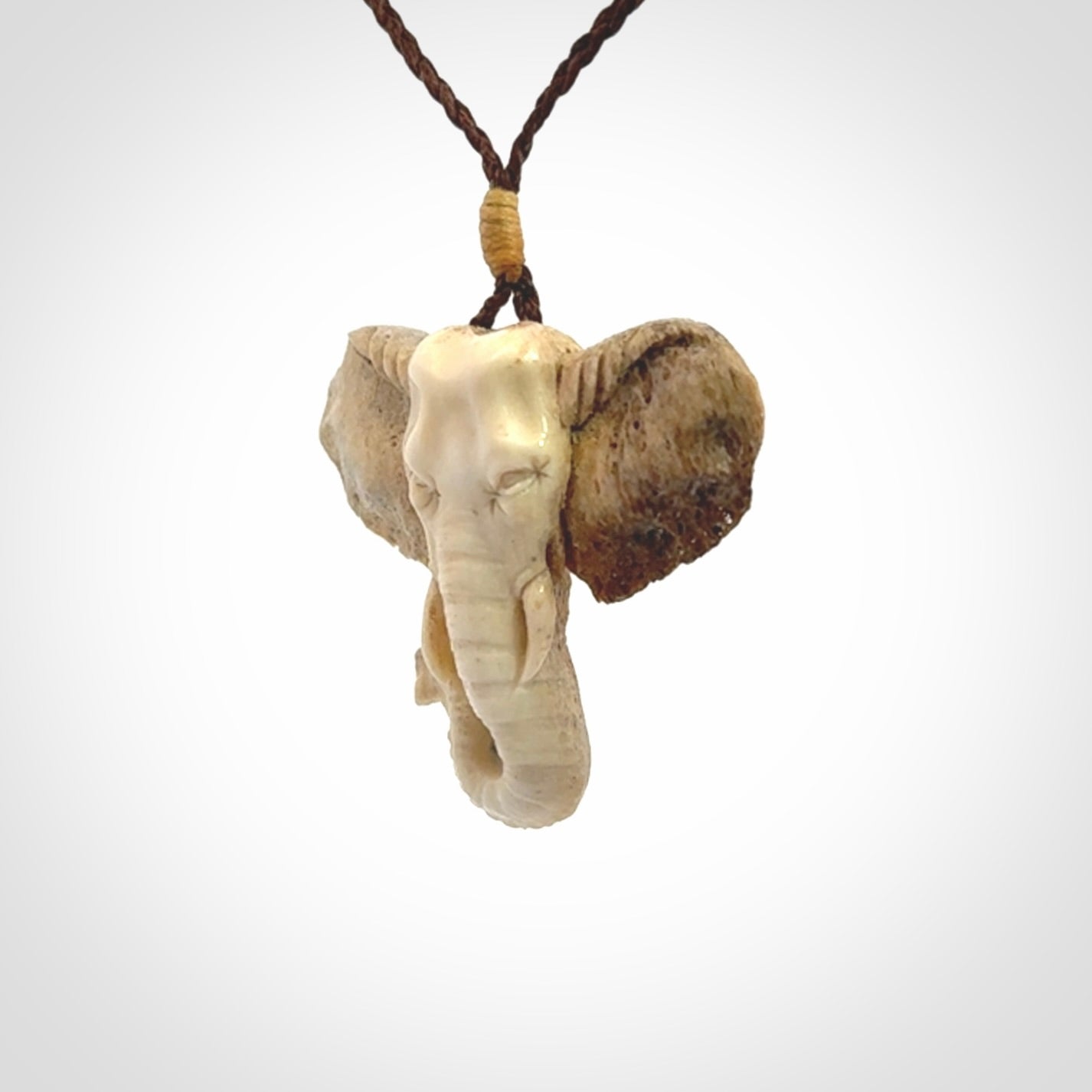 These are hand made elephant pendants, carved in a Deer Antler. The cord is length adjustable. Provided in a woven kete pouch and delivered with express courier.