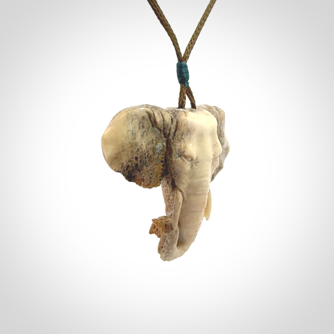 These are hand made elephant pendants, carved in a Deer Antler. The cord is length adjustable. Provided in a woven kete pouch and delivered with express courier.