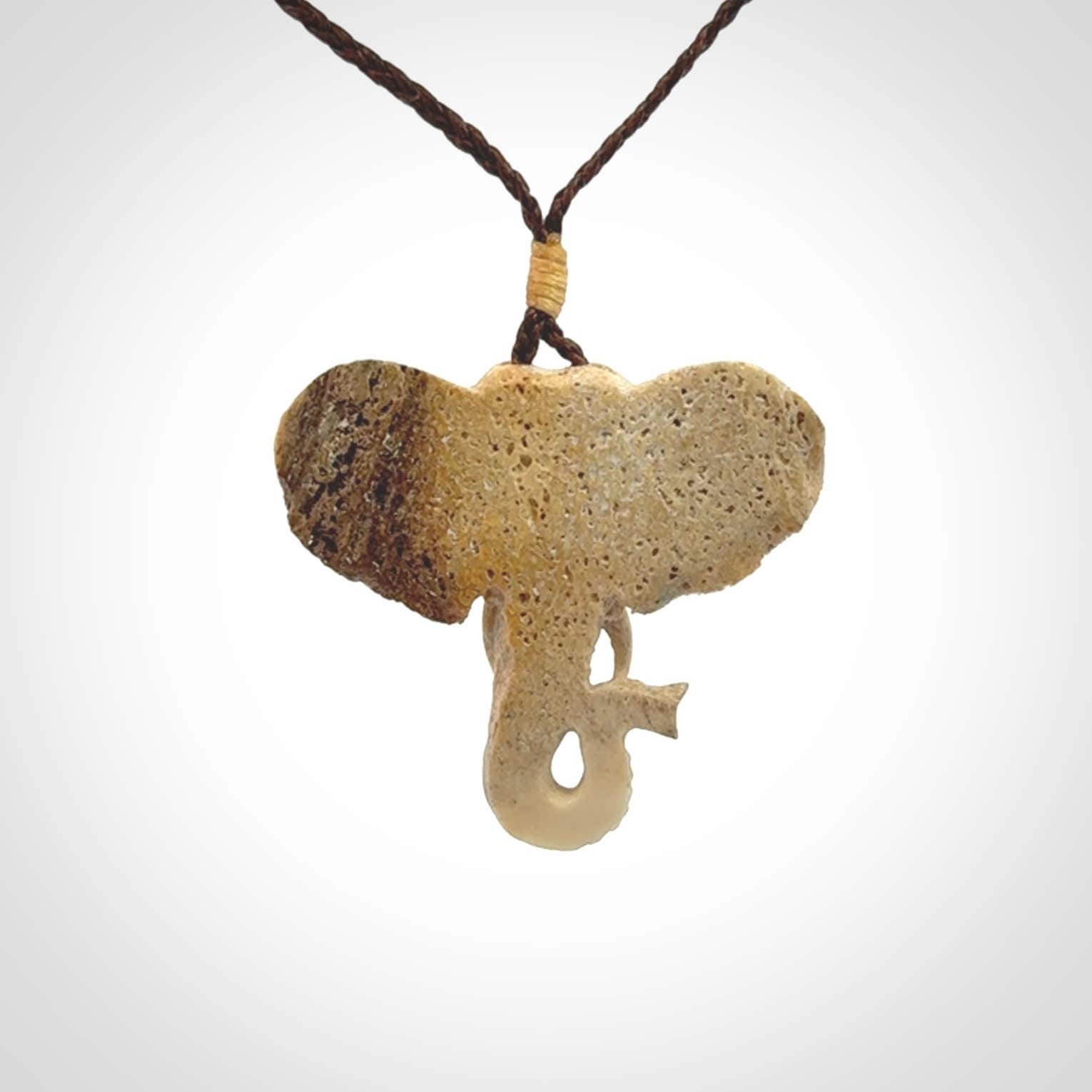 These are hand made elephant pendants, carved in a Deer Antler. The cord is length adjustable. Provided in a woven kete pouch and delivered with express courier.