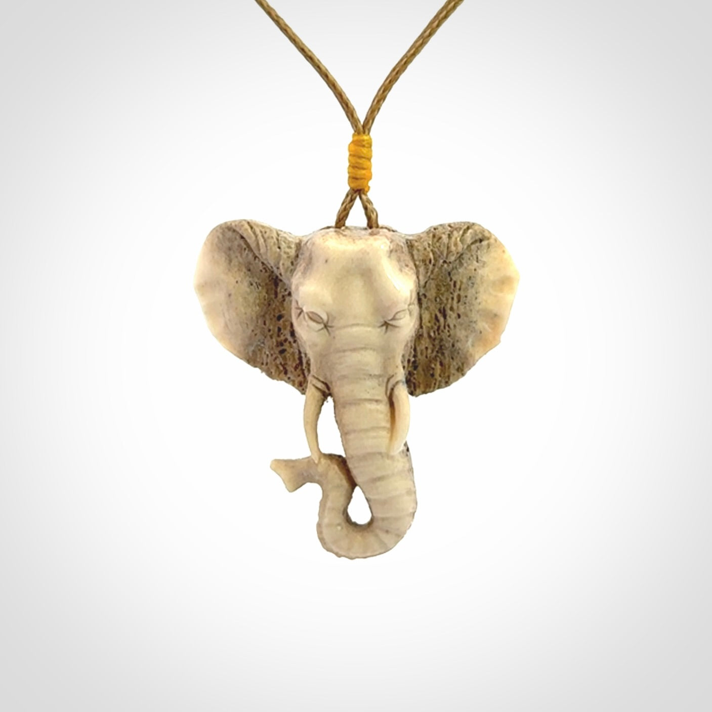 These are hand made elephant pendants, carved in a Deer Antler. The cord is length adjustable. Provided in a woven kete pouch and delivered with express courier.