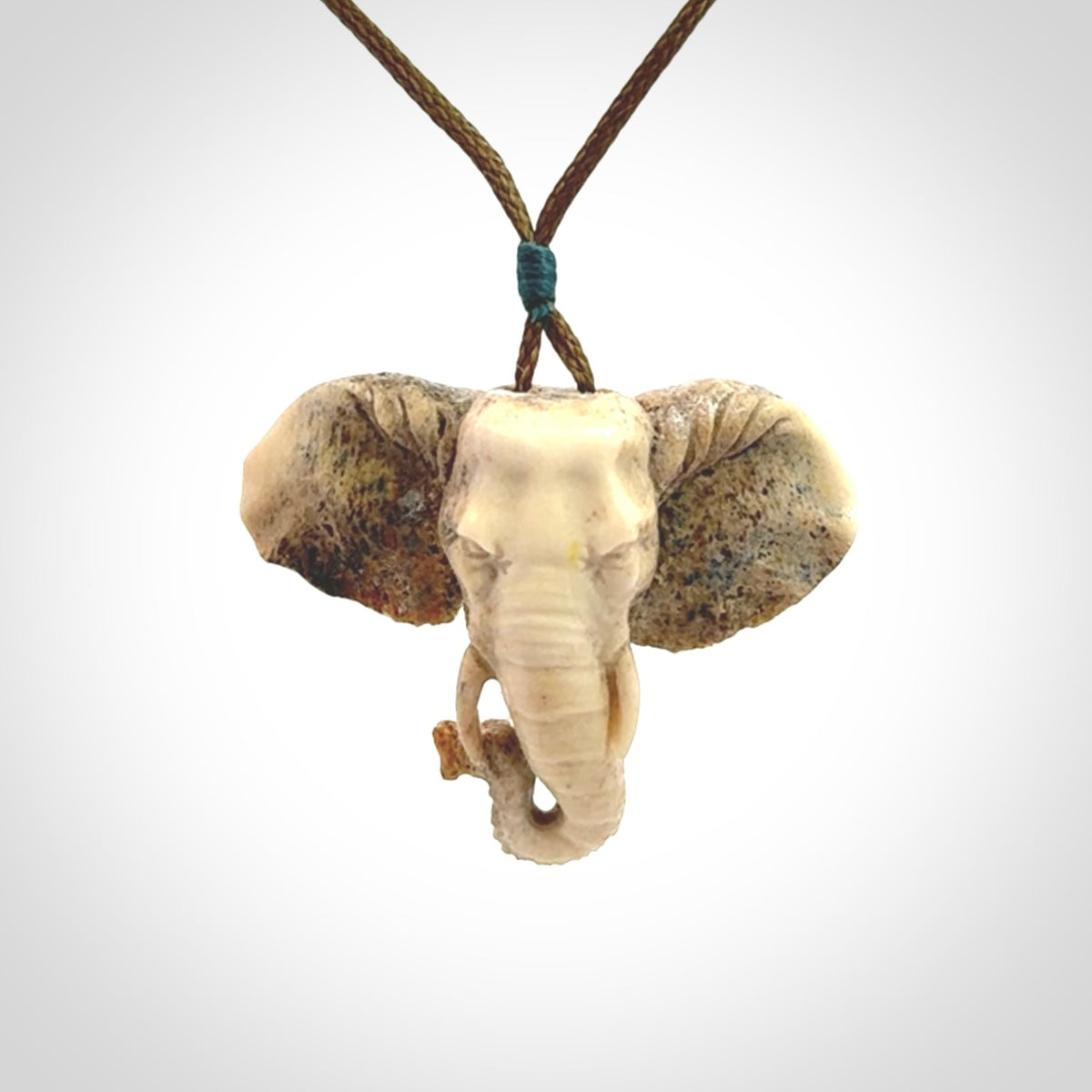 These are hand made elephant pendants, carved in a Deer Antler. The cord is length adjustable. Provided in a woven kete pouch and delivered with express courier.