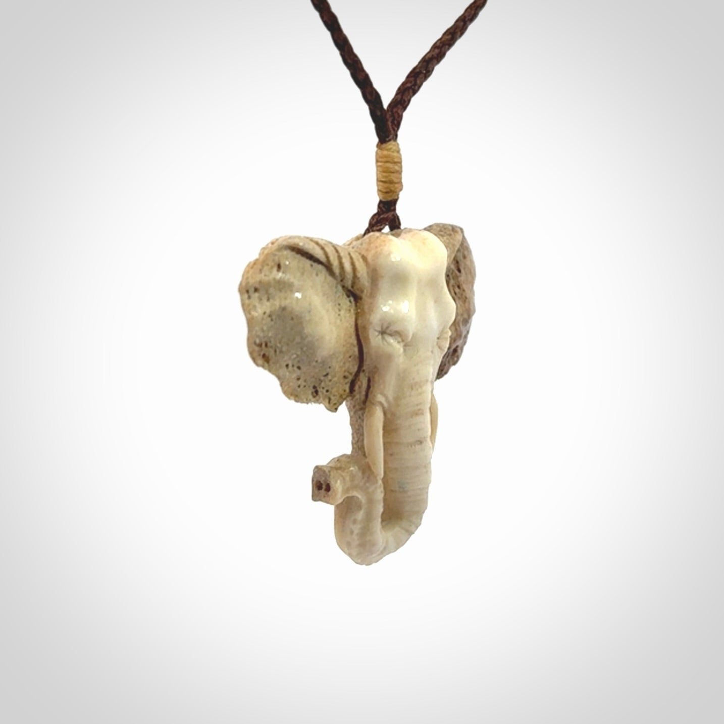 These are hand made elephant pendants, carved in a Deer Antler. The cord is length adjustable. Provided in a woven kete pouch and delivered with express courier.