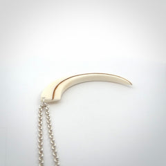 Hand carved incredible Huia bird beak bone carving. A stunning work of art, beautifully replicating a hula bird beak. This pendant was hand carved in bone by artist Sami. A one off collectors item that has been hand crafted to be worn or displayed.