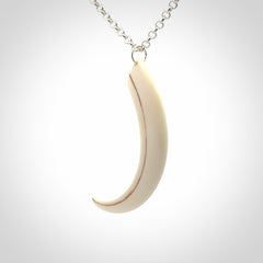 Hand carved incredible Huia bird beak bone carving. A stunning work of art, beautifully replicating a hula bird beak. This pendant was hand carved in bone by artist Sami. A one off collectors item that has been hand crafted to be worn or displayed.