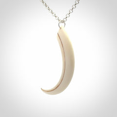 Hand carved incredible Huia bird beak bone carving. A stunning work of art, beautifully replicating a hula bird beak. This pendant was hand carved in bone by artist Sami. A one off collectors item that has been hand crafted to be worn or displayed.