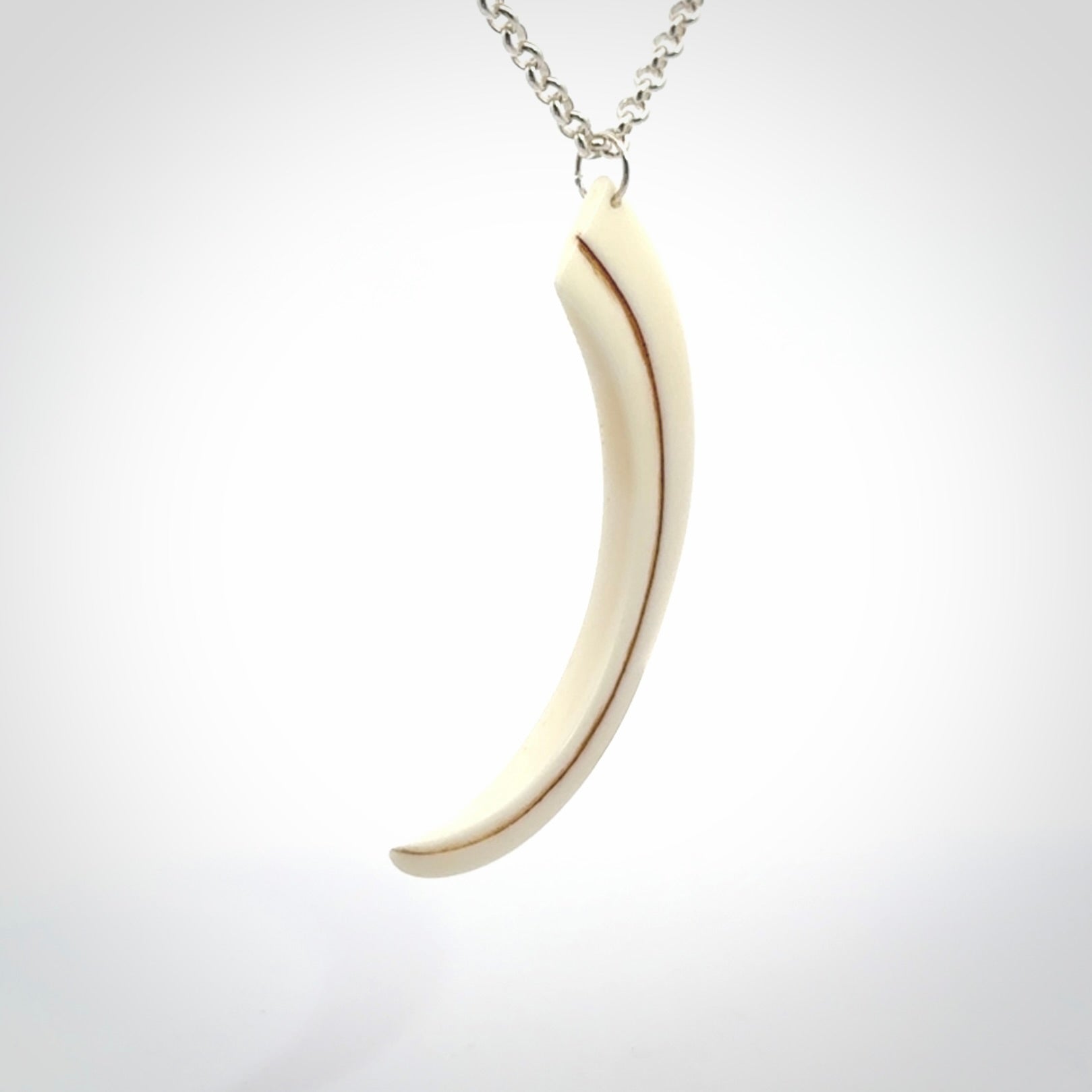 Hand carved incredible Huia bird beak bone carving. A stunning work of art, beautifully replicating a hula bird beak. This pendant was hand carved in bone by artist Sami. A one off collectors item that has been hand crafted to be worn or displayed.