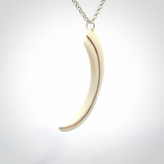 Hand carved incredible Huia bird beak bone carving. A stunning work of art, beautifully replicating a hula bird beak. This pendant was hand carved in bone by artist Sami. A one off collectors item that has been hand crafted to be worn or displayed.