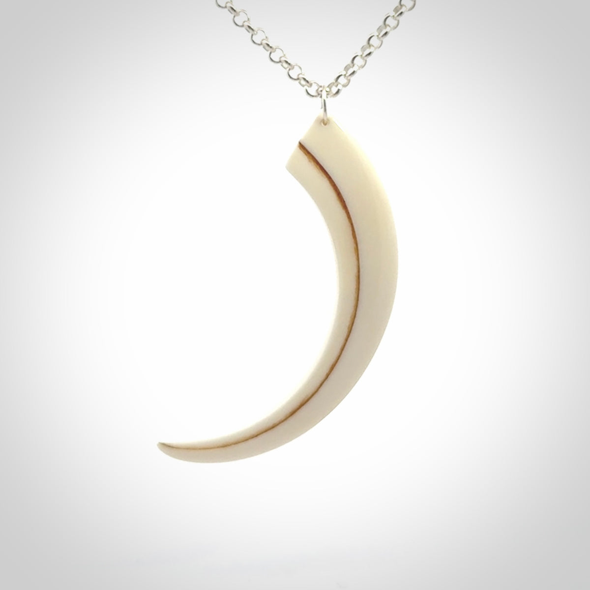 Hand carved incredible Huia bird beak bone carving. A stunning work of art, beautifully replicating a hula bird beak. This pendant was hand carved in bone by artist Sami. A one off collectors item that has been hand crafted to be worn or displayed.