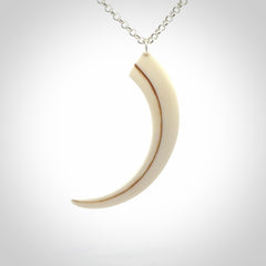 Hand carved incredible Huia bird beak bone carving. A stunning work of art, beautifully replicating a hula bird beak. This pendant was hand carved in bone by artist Sami. A one off collectors item that has been hand crafted to be worn or displayed.