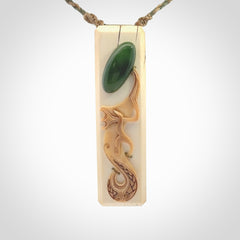 A beautiful, large toki with manaia pendant handmade from woolly mammoth tusk with Jade insert.