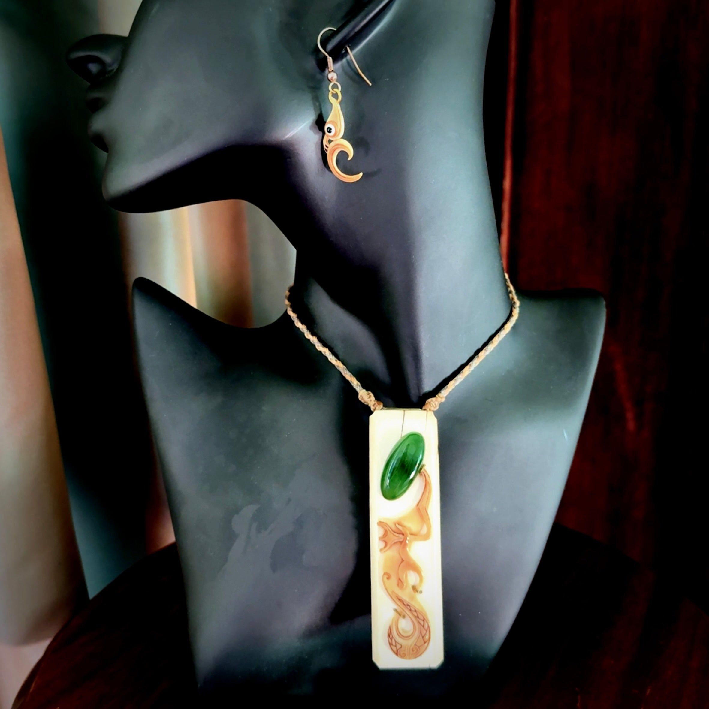 A beautiful, large woolly mammoth tusk with Jade insert toki pendant and woolly mammoth tusk earring.