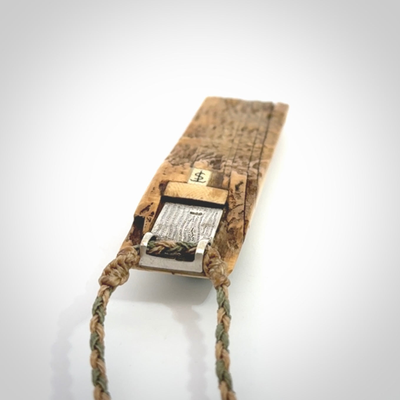 A beautiful, large toki with manaia pendant handmade from woolly mammoth tusk with Jade insert.