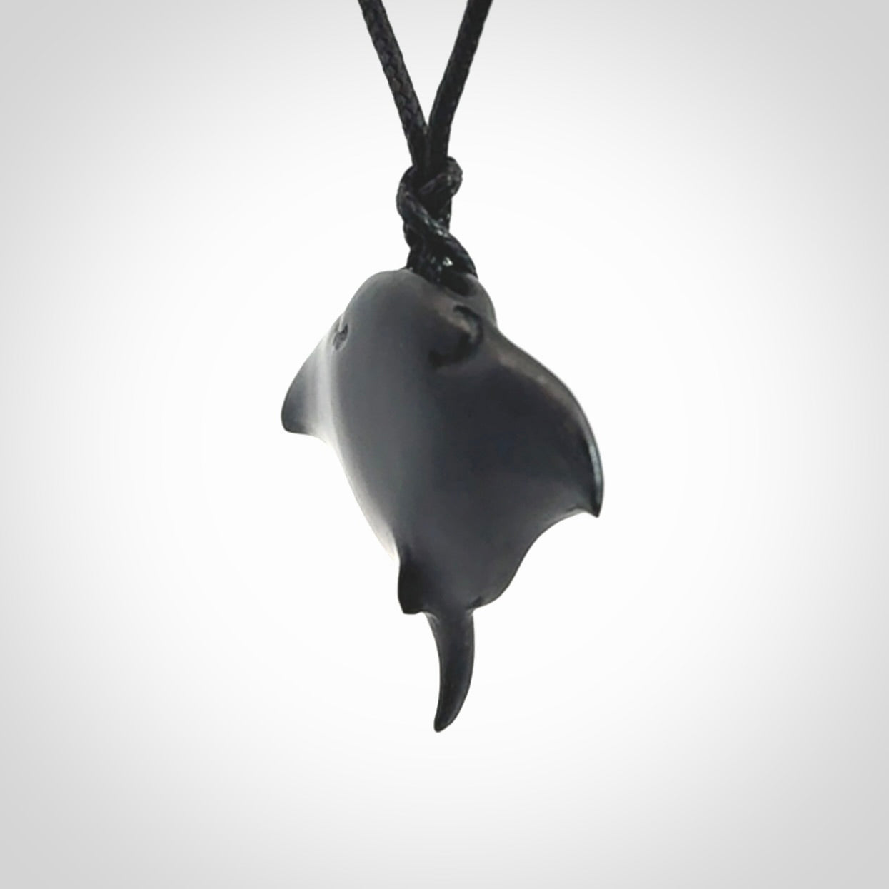 Hand carved manta ray pendant. Black jade manta pendant hand carved by NZ Pacific. Black jade jewellery for sale online.